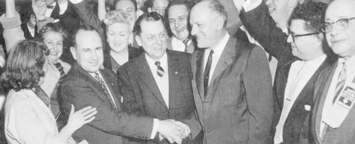 Jubilation at Civic Party headquarters in April 1959 after election victory; clasping hands are, from left, Albert Smith, Ray Jackson and Bill Siegel.